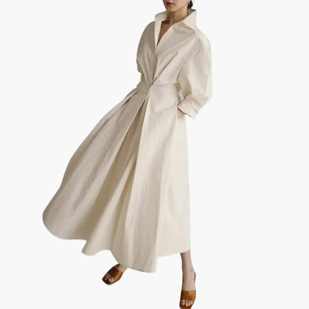 Elegant women's maxi shirt dress. Features a defined waist & full button front closure. Ideal for summer.