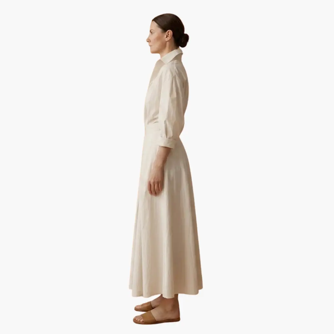Stylish long women's shirt dress with defined waist. Button front & long sleeves for spring/summer elegance.