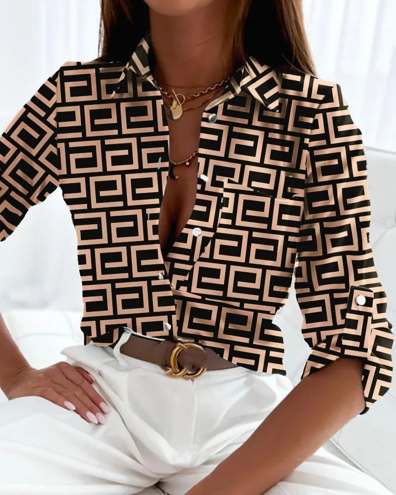 Abstract print women's long sleeve button-down blouse. Fashionable collared top for casual chic or professional wear.
