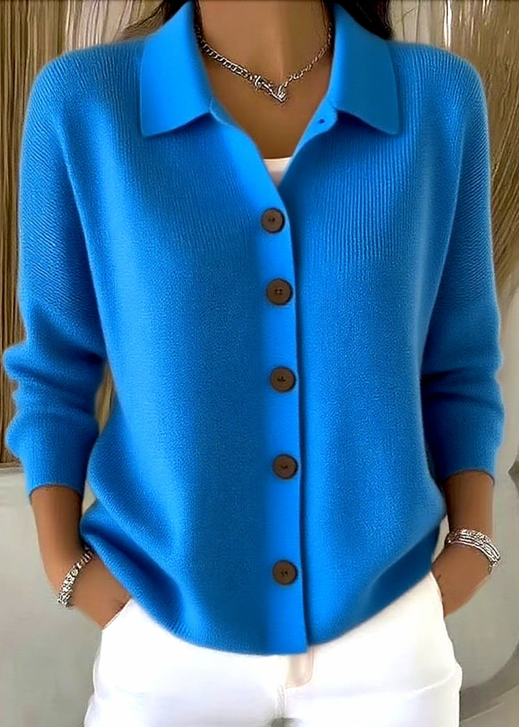 Versatile women's button-down cardigan with a sophisticated shirt collar, a comfortable layering piece for any season.