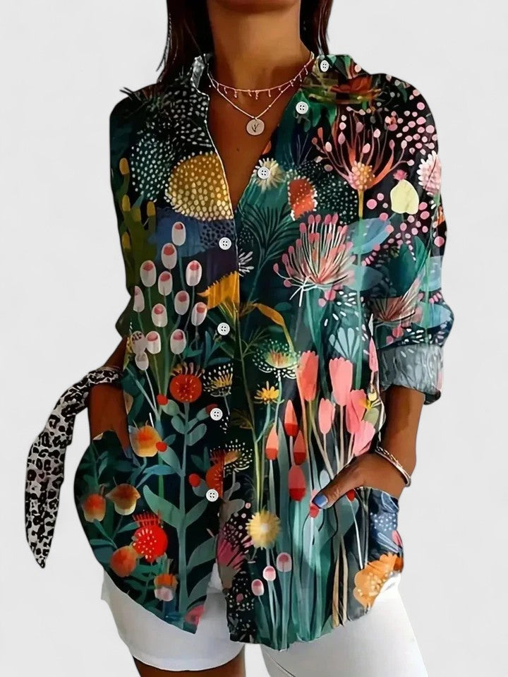 Elegant women's blouse with an artistic abstract floral print. Button down, long sleeve, for casual spring.