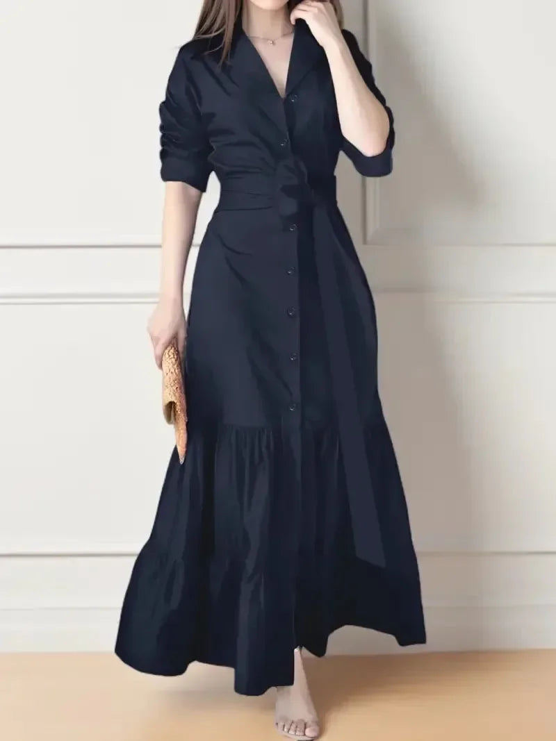 Model wearing a graceful women's long sleeve tiered maxi shirt dress with tie waist, showcasing its flowy design.