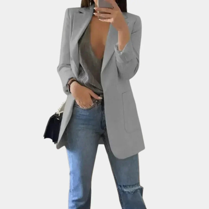 Professional women's long blazer featuring a flattering slim fit. Perfect chic outerwear for modern office style.