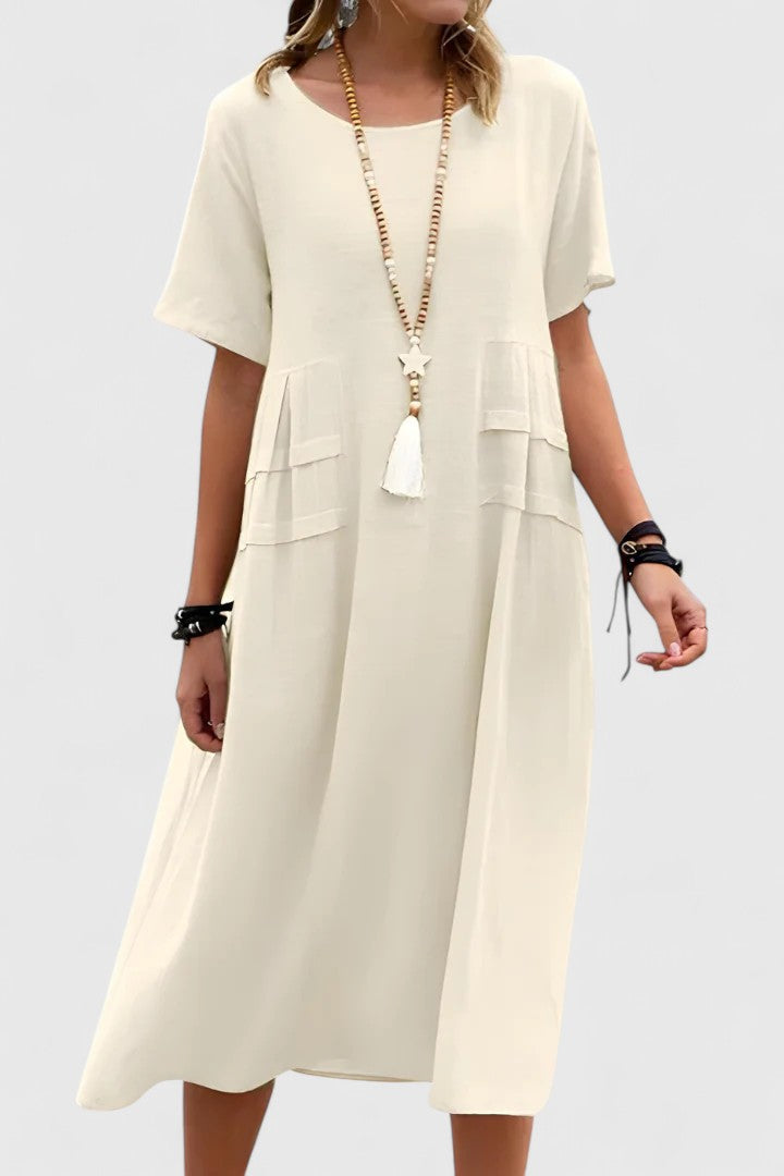 Versatile women's midi dress, loose fit with short sleeves & pockets. Perfect for casual, comfortable everyday summer style.