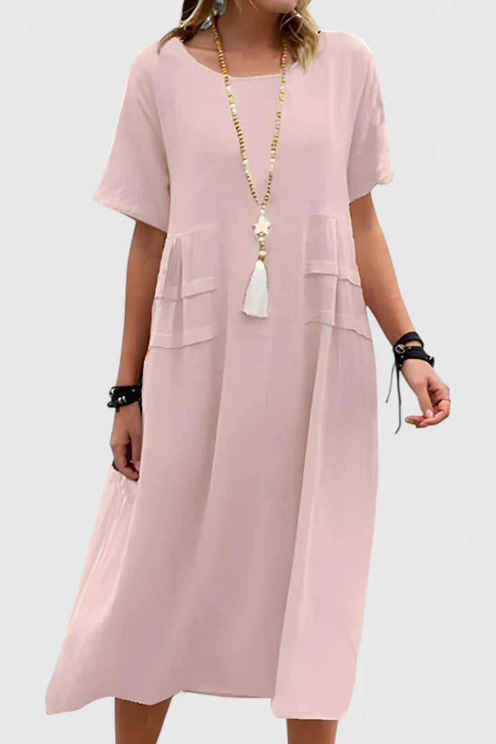 Loose fit women's midi dress with short sleeves and convenient pockets. Casual, comfortable, and stylish for summer.