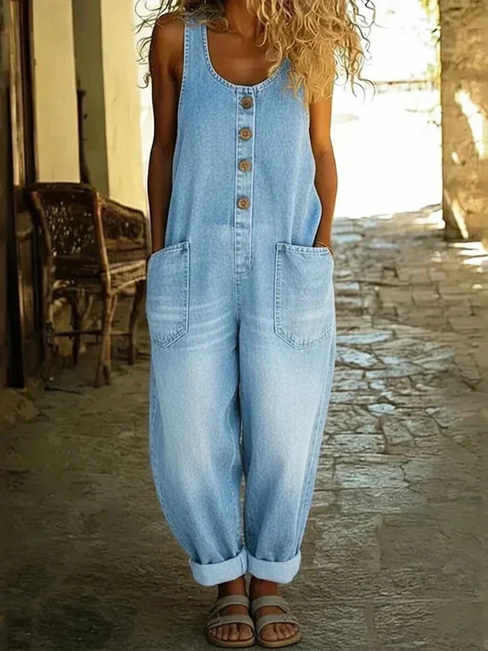 Women's loose fit sleeveless overalls jumpsuit in light wash denim, perfect for casual spring fashion.