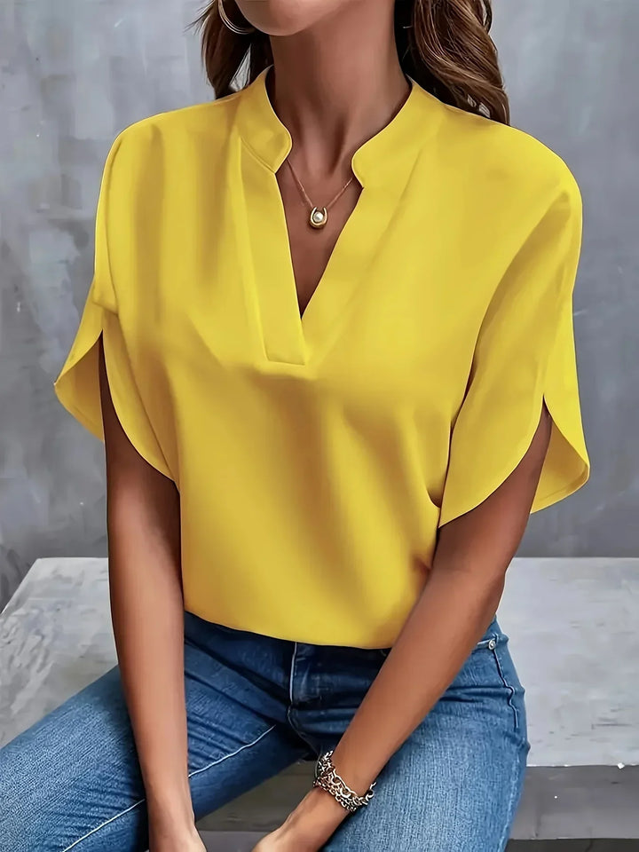 Versatile women's V-neck blouse with short sleeves and loose fit, perfect for everyday fashion.