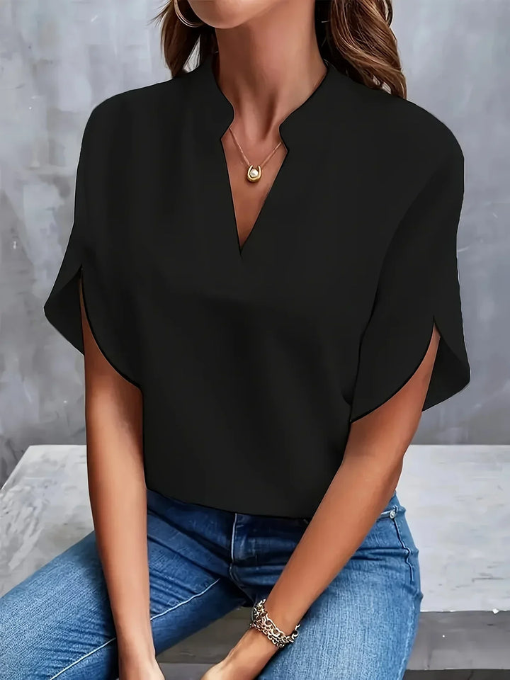 Casual women's short sleeve V-neck top, a loose fit blouse ideal as a comfortable summer shirt.