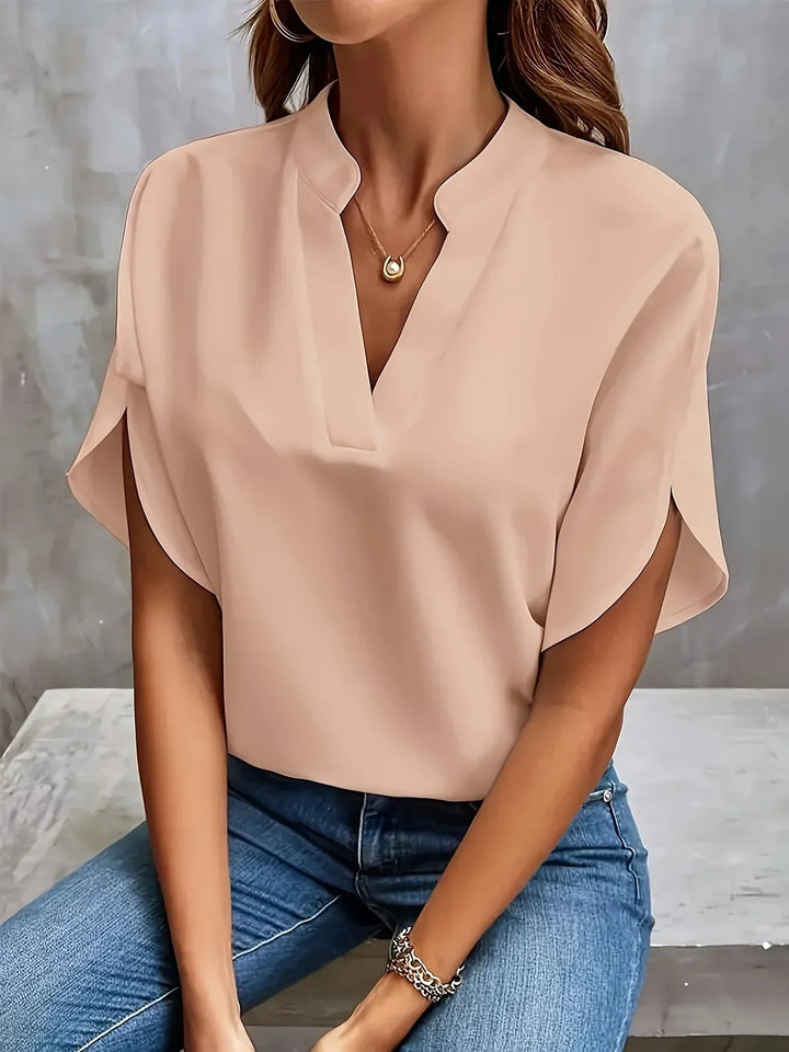 Chic women's short sleeve V-neck blouse, loose fit design for an elegant and professional office look.