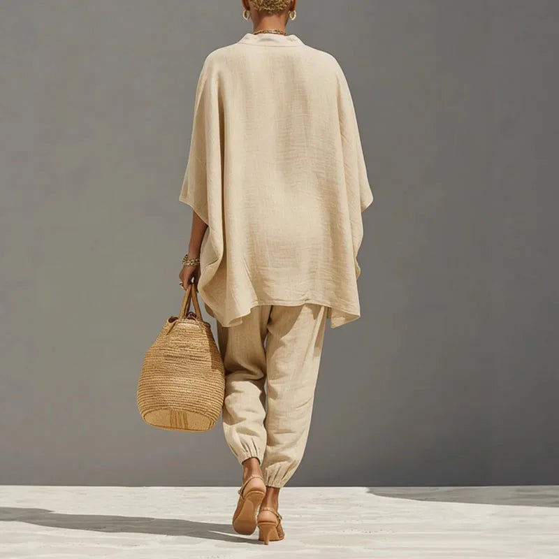 Apricot linen blend two-piece set for women, featuring a relaxed batwing top & comfortable tapered pants.