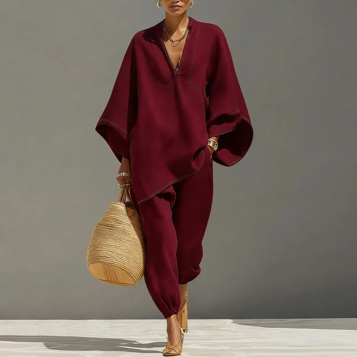Loose linen blend women's loungewear set in wine red; features a batwing top and tapered pants for comfort.