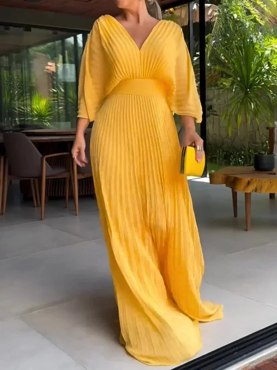 Elegant women's pleated V-neck kaftan maxi dress, perfect for summer occasion wear or wedding guests.