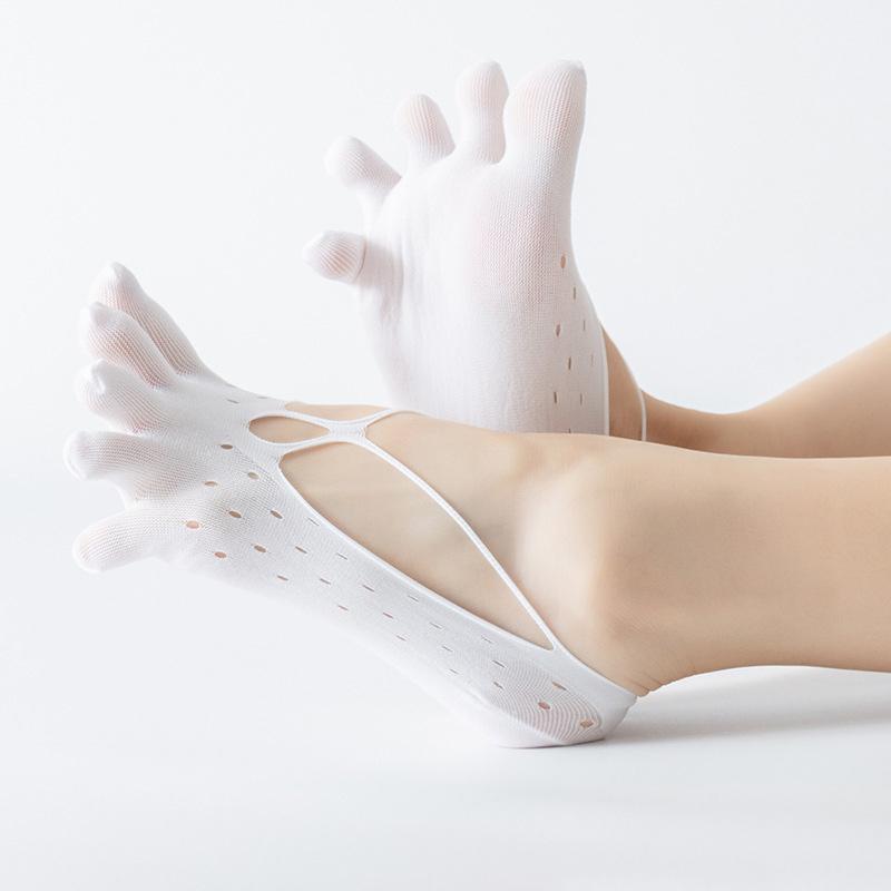 Stack of folded women's low-cut toe socks, emphasizing their compact size and soft texture.