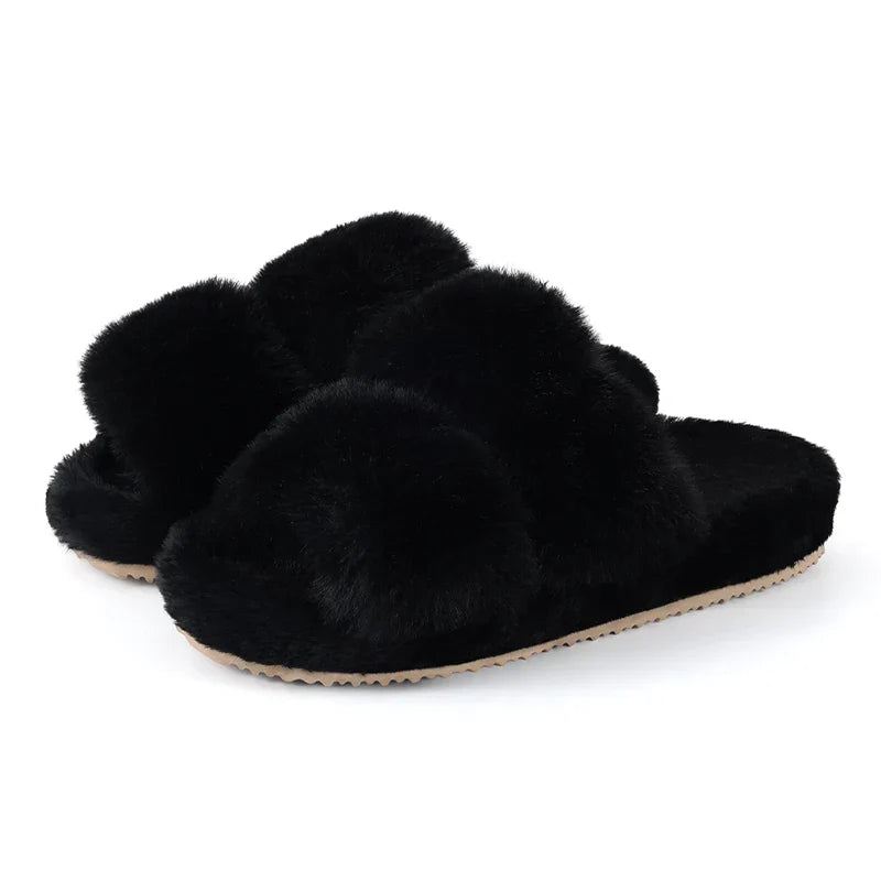 Pair of black faux fur slide slippers for women, showcasing their elegant design and comfort.