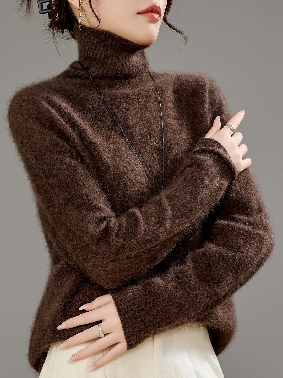 Women's luxurious turtleneck sweater, perfect for winter comfort & elegant style.