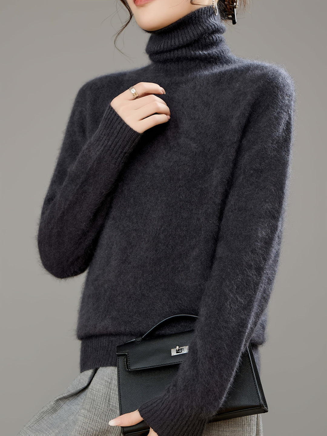 Cozy knit women's turtleneck sweater in a relaxed fit for ultimate winter warmth.