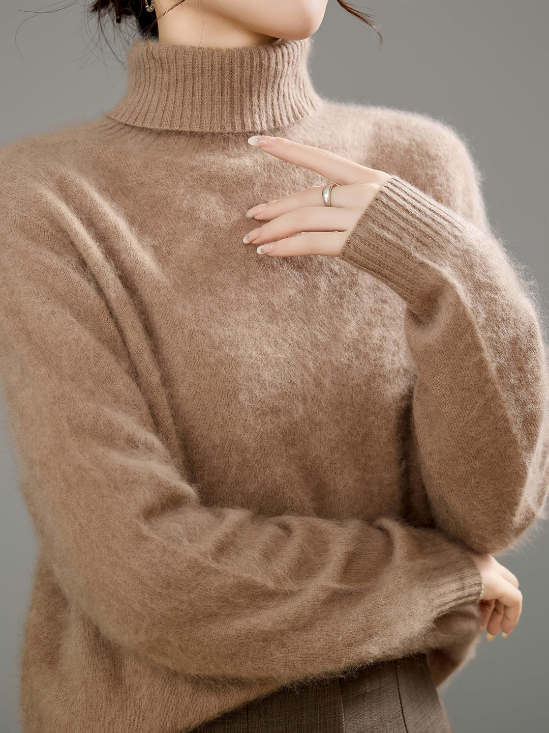 Elegant women's luxurious turtleneck sweater, ideal for cold weather fashion.