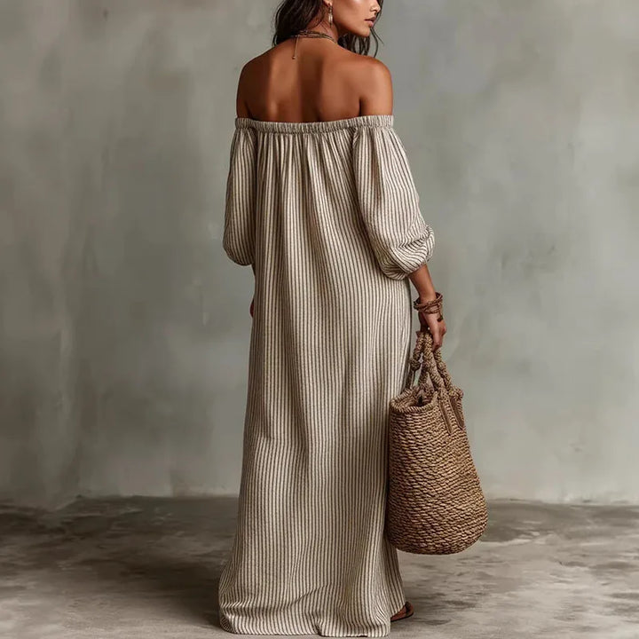 Elegant flowy Madison midi dress, off-shoulder design, ideal for versatile day-to-night styling.