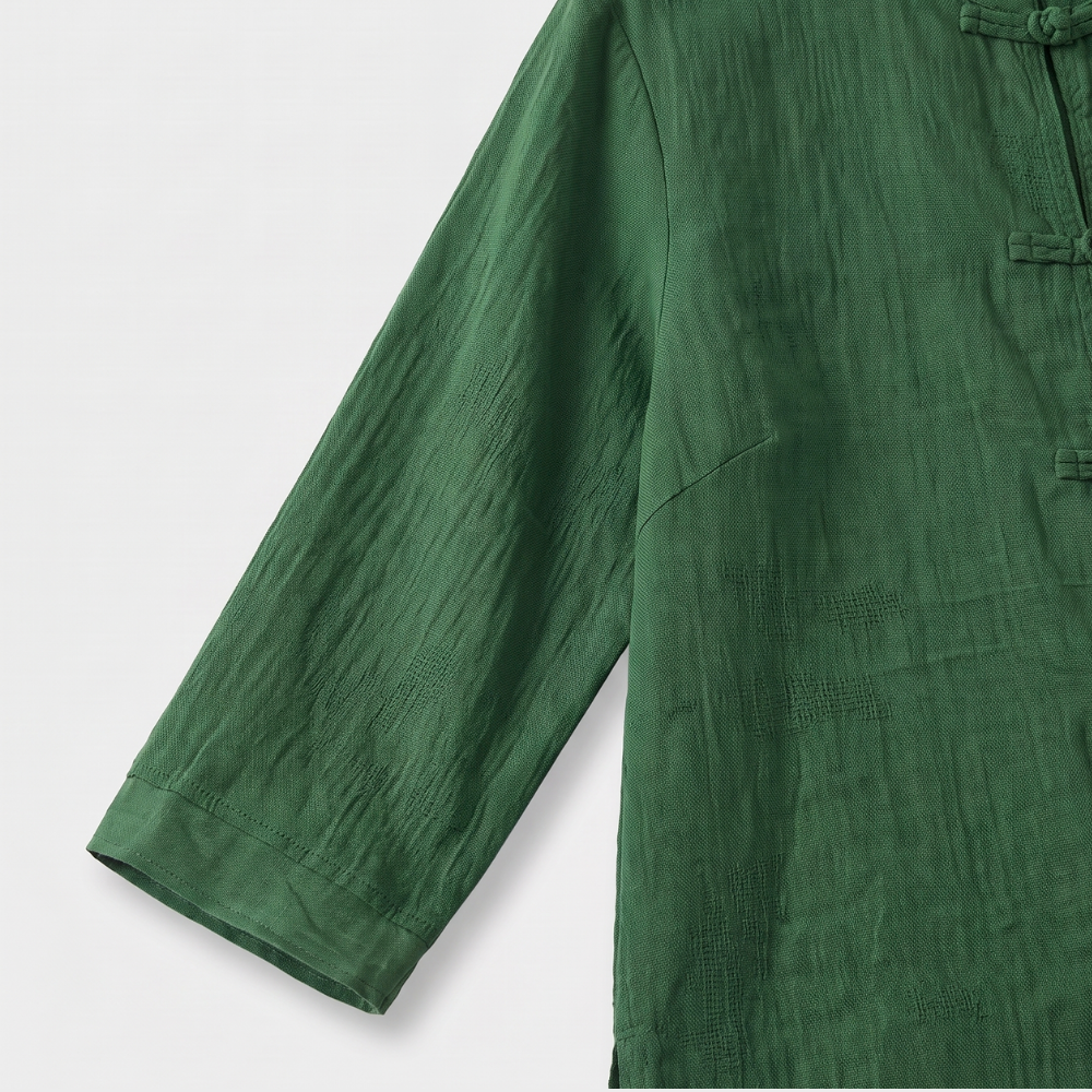 Front view: Women's mandarin collar blouse with intricate frog button detail, elegant.