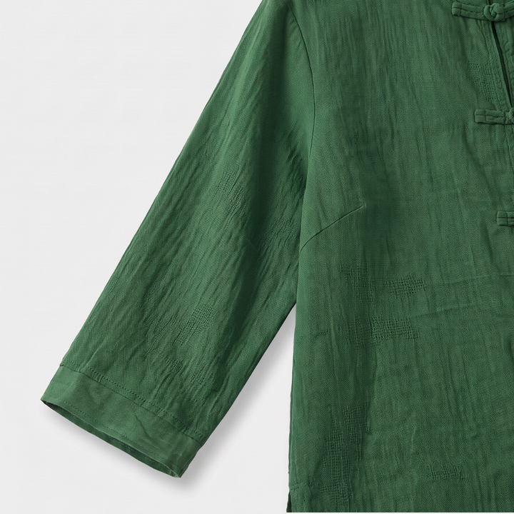 Front view: Women's mandarin collar blouse with intricate frog button detail, elegant.