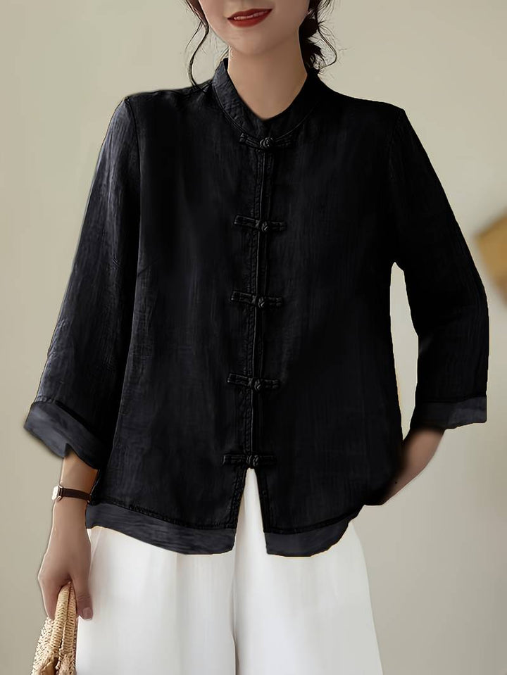 Three-quarter sleeve women's blouse, mandarin collar, frog button detail for a unique look.