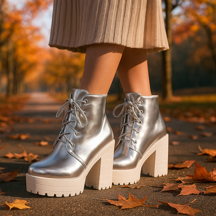 Pair of women's metallic orthopedic platform boots, comfortable and stylish ankle footwear.