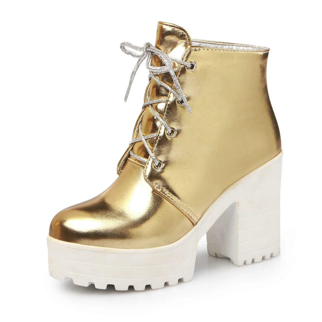 Detail shot of the durable sole and metallic finish on women's lace-up platform ankle boots.