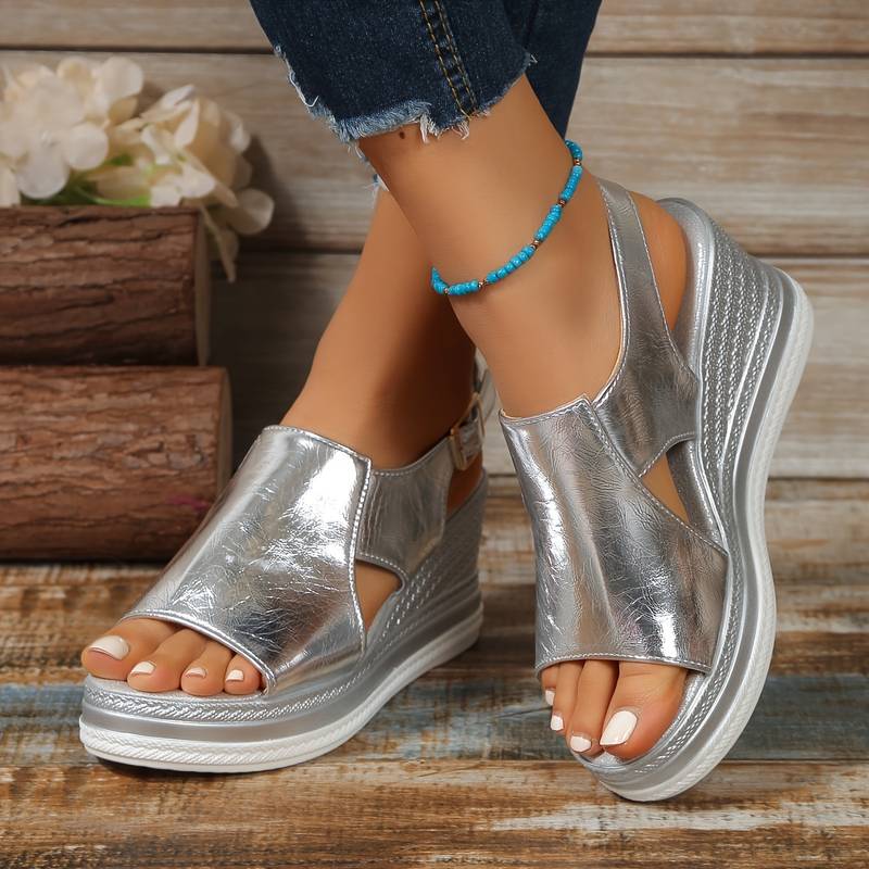 Women's metallic silver platform slingback sandals, perfect for parties & summer fashion. Open-toe wedge.