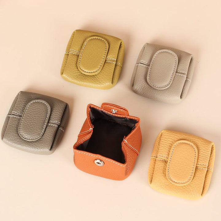 Women's mini black leather coin purse with zipper closure, compact design for everyday carry