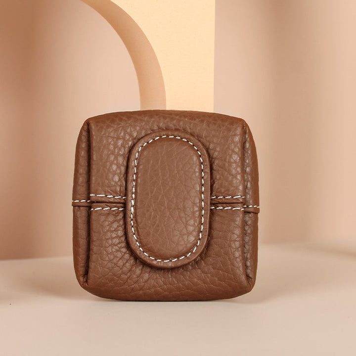 Empty mini black leather coin purse, ready to be filled with everyday essentials