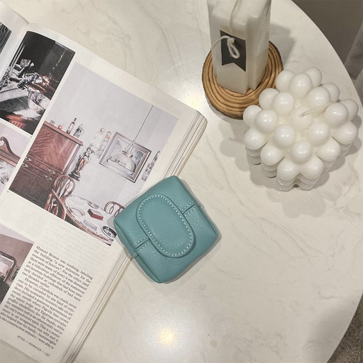 Mini white leather coin purse with a delicate stitching detail, artisanal quality