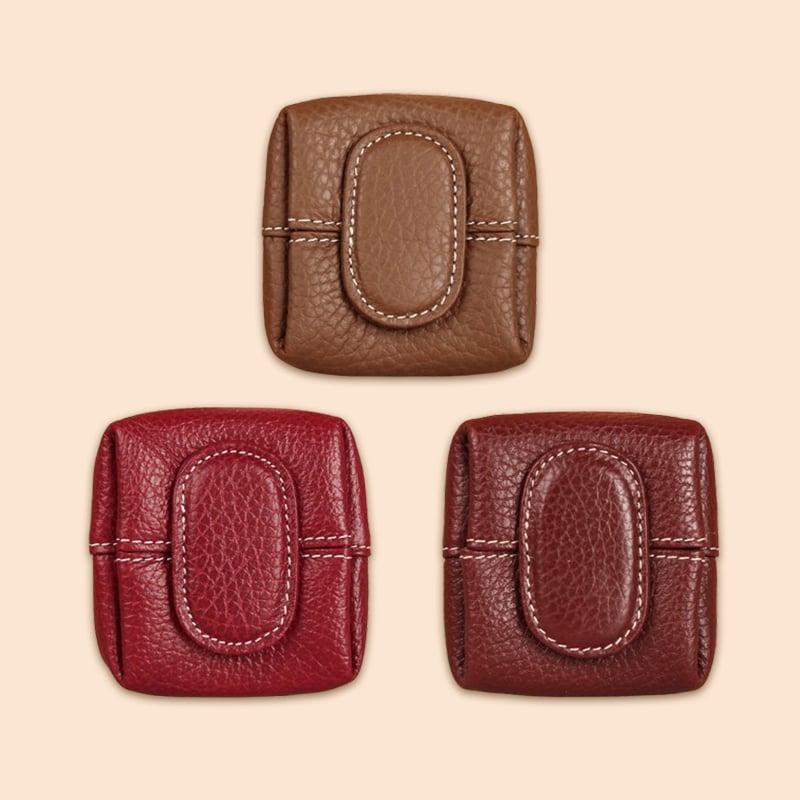 Mini brown leather coin purse with keychain attachment, practical everyday carry