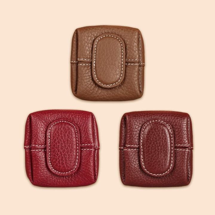 Mini brown leather coin purse with keychain attachment, practical everyday carry