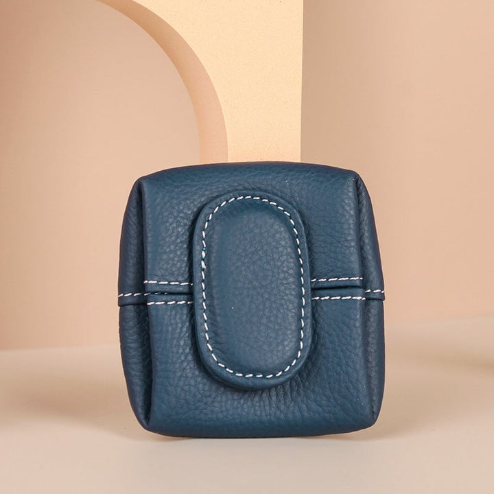 Group shot of assorted mini leather coin purses, showcasing the full range of colors