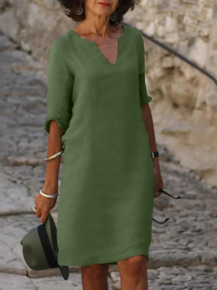 Elegant women's 3/4 sleeve V-neck mini dress, comfortable & stylish for everyday occasions.