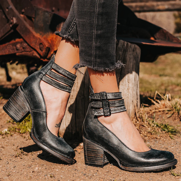 Women's multi-strap block heel ankle boots; stylish & versatile fall/winter footwear.