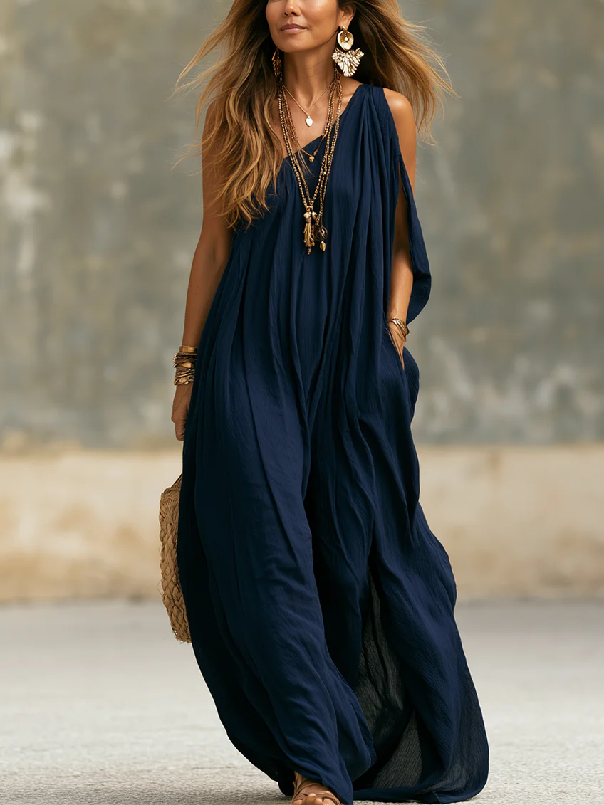 Women's navy one-shoulder wide-leg jumpsuit, bohemian style. Flowy summer resort wear, perfect for chic evening events.
