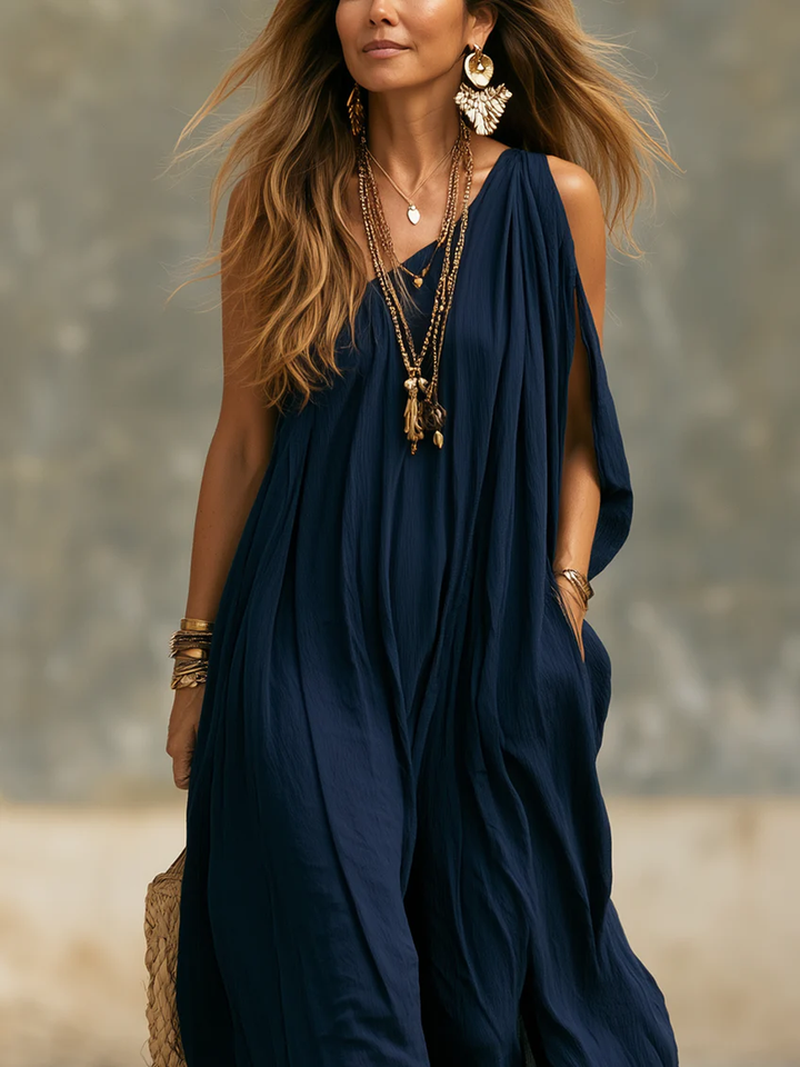 Elegant women's navy one-shoulder wide-leg jumpsuit. Bohemian resort wear, ideal for summer parties or casual chic.