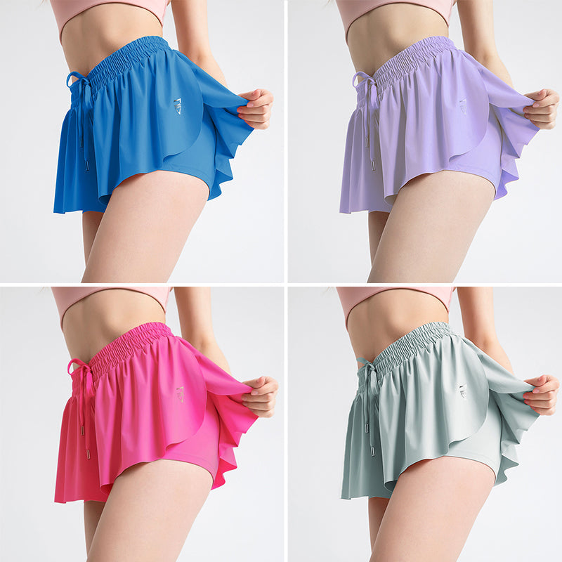 Front view of a women's black pleated tennis skirt with shorts, ready for court action