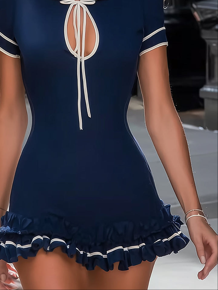Preppy navy tie neck mini dress for women with short sleeves & ruffle hem. Versatile elegant style for summer brunches & casual outings.
