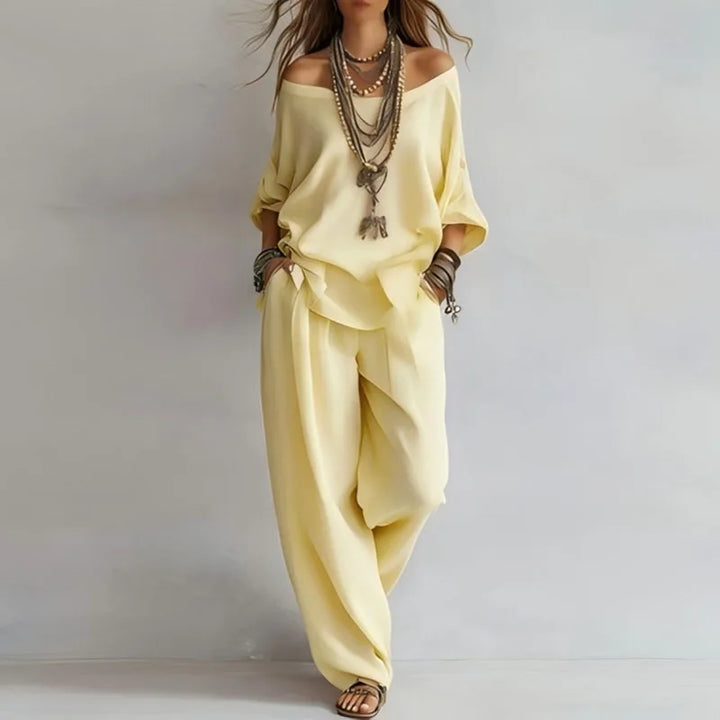 Stylish women's off-shoulder matching set. Chic two-piece outfit with wide leg pants for effortless summer wear.