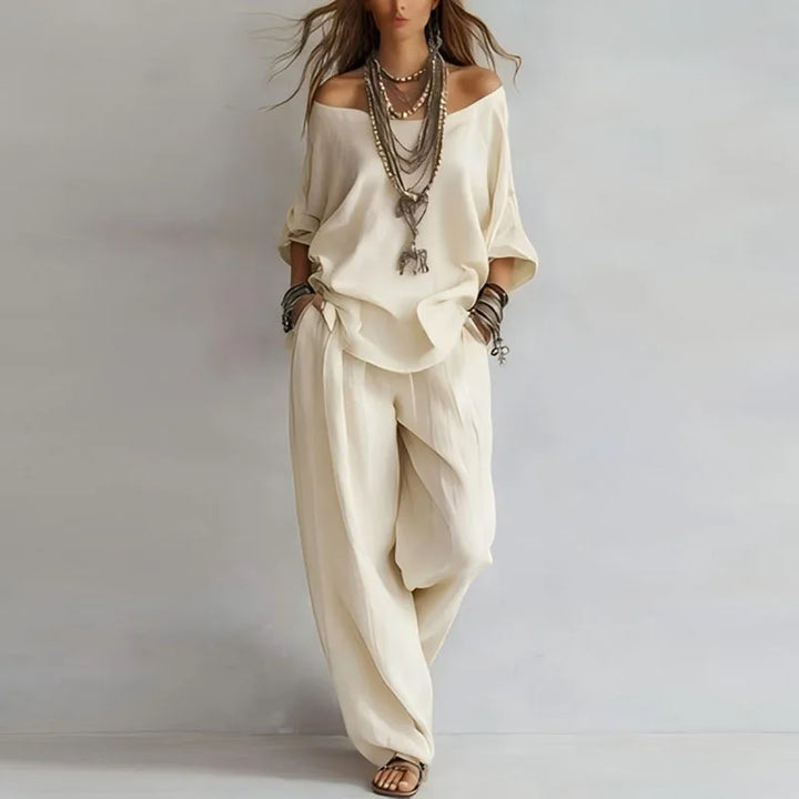 Women's off-shoulder top and wide-leg pant co-ord set. Comfortable two-piece outfit for stylish summer casuals.