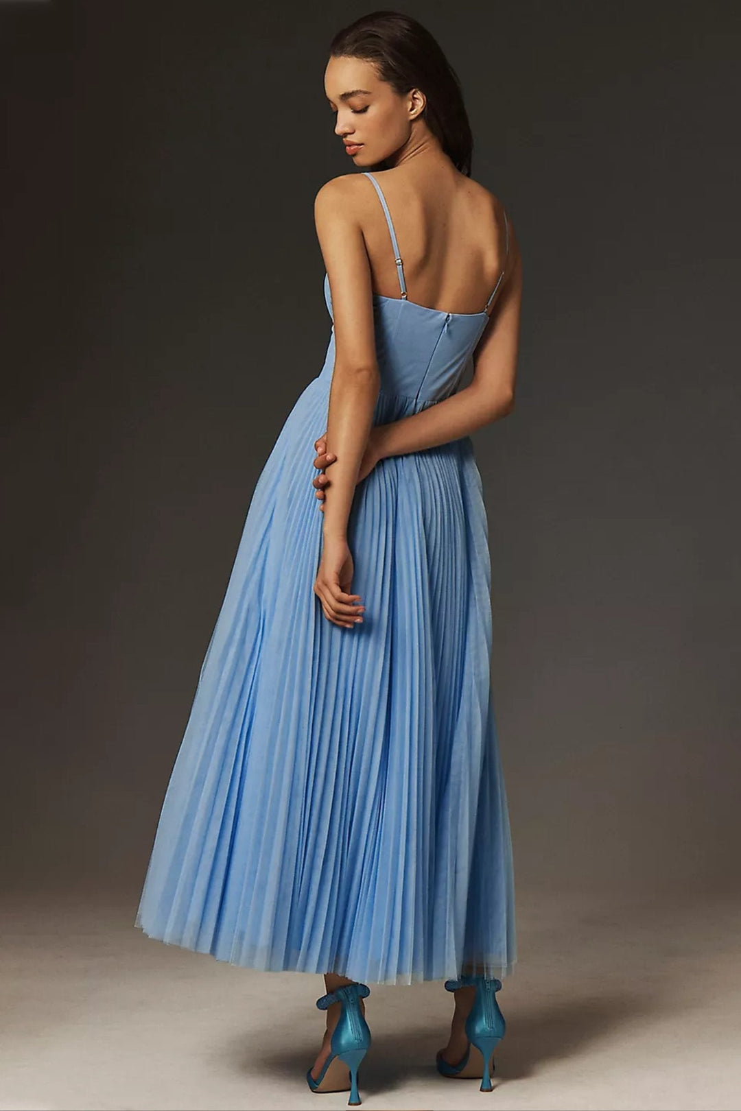 Delicate pleated tulle one-shoulder midi dress. An elegant choice for women attending weddings, parties, or formal events.