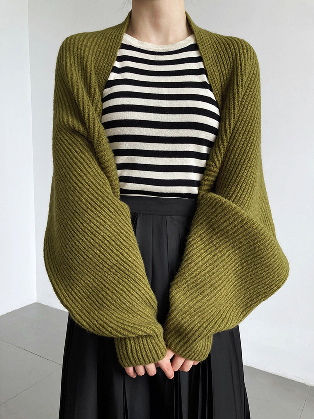 Soft knit women's long sleeve open-front shrug sweater. Comfortable, regular fit cardigan for versatile styling.