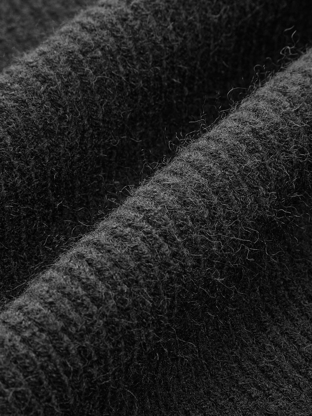 Detail of the long sleeve & open front on a women's casual shrug sweater. Perfect for layering.