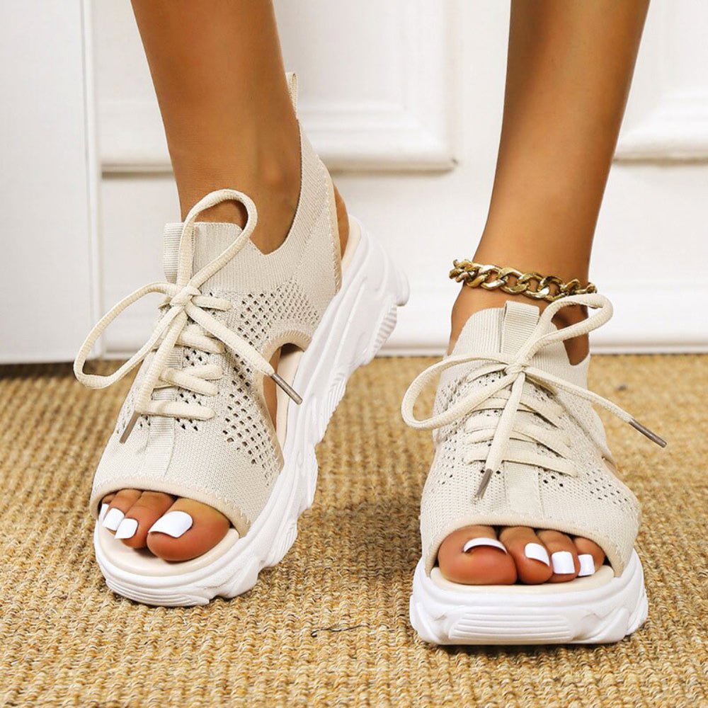 Stylish beige open-toe platform sandals for women, featuring a comfortable lace-up design for summer.