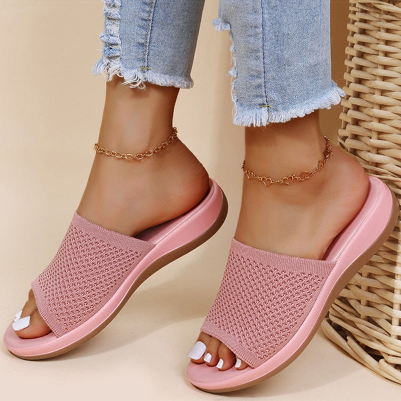 Women's open-toe slippers with breathable design for comfort. Ideal casual slip-on house shoes for summer.