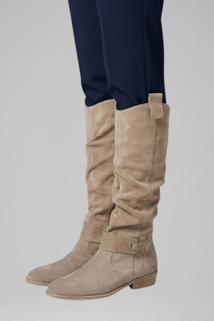 Fashionable women's knee-high orthopaedic boots with practical side zipper for casual winter style.