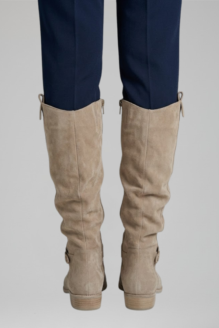 Supportive women's orthopaedic knee-high boots; comfortable design with side zipper for easy wear.