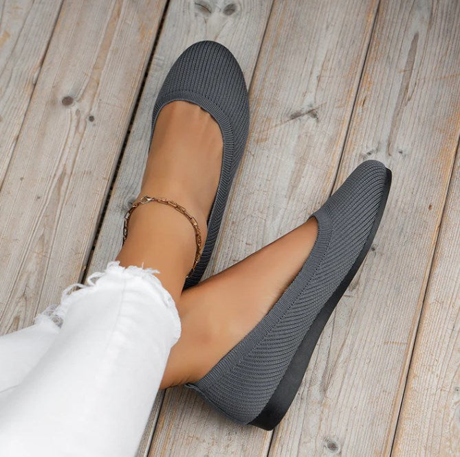 Slip-on women's comfort ballet flats with breathable material, rounded toe & foot support.
